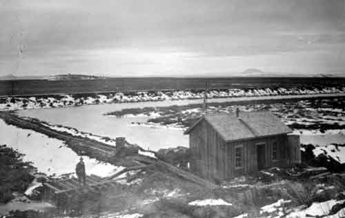 The pumphouse at the Experimental Farm at Lower Klamath Lake looking cross the railroad grade toward the marsh.  February 14, 1909.